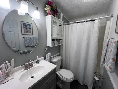 Beautifully maintained 2-bedroom, 2-bath home offering comfort on Lake Henry Golf Club in Florida - for sale on GolfHomes.com, golf home, golf lot