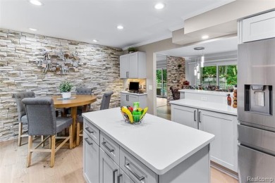 Nestled along a picturesque golf course and completely updated on Oak Pointe Country Club in Michigan - for sale on GolfHomes.com, golf home, golf lot