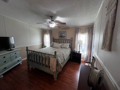 Beautifully maintained 2-bedroom, 2-bath home offering comfort on Lake Henry Golf Club in Florida - for sale on GolfHomes.com, golf home, golf lot