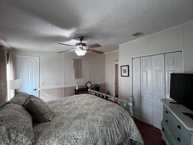 Beautifully maintained 2-bedroom, 2-bath home offering comfort on Lake Henry Golf Club in Florida - for sale on GolfHomes.com, golf home, golf lot