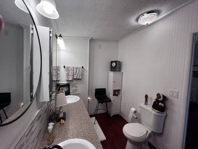 Beautifully maintained 2-bedroom, 2-bath home offering comfort on Lake Henry Golf Club in Florida - for sale on GolfHomes.com, golf home, golf lot