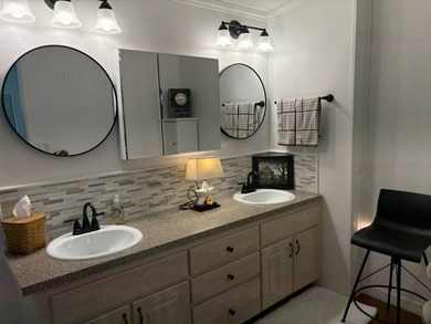 Beautifully maintained 2-bedroom, 2-bath home offering comfort on Lake Henry Golf Club in Florida - for sale on GolfHomes.com, golf home, golf lot