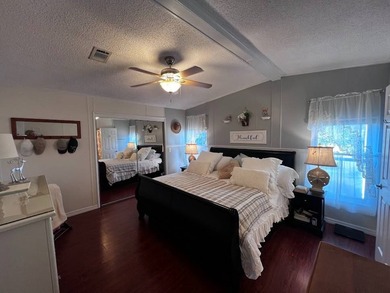 Beautifully maintained 2-bedroom, 2-bath home offering comfort on Lake Henry Golf Club in Florida - for sale on GolfHomes.com, golf home, golf lot