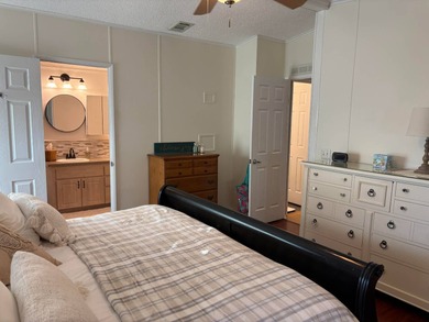 Beautifully maintained 2-bedroom, 2-bath home offering comfort on Lake Henry Golf Club in Florida - for sale on GolfHomes.com, golf home, golf lot