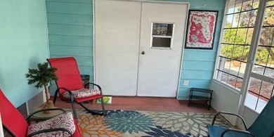 Beautifully maintained 2-bedroom, 2-bath home offering comfort on Lake Henry Golf Club in Florida - for sale on GolfHomes.com, golf home, golf lot