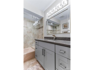 Nestled along a picturesque golf course and completely updated on Oak Pointe Country Club in Michigan - for sale on GolfHomes.com, golf home, golf lot