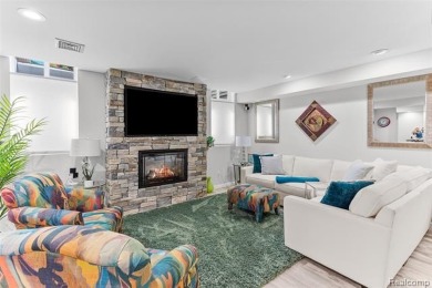 Nestled along a picturesque golf course and completely updated on Oak Pointe Country Club in Michigan - for sale on GolfHomes.com, golf home, golf lot