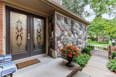 Nestled along a picturesque golf course and completely updated on Oak Pointe Country Club in Michigan - for sale on GolfHomes.com, golf home, golf lot