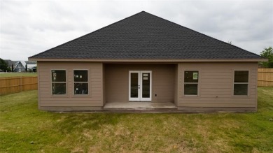 This fresh and functional 3-bedroom, 2-bath home offers style on The Club At Runaway Bay in Texas - for sale on GolfHomes.com, golf home, golf lot