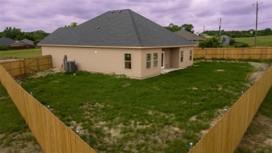This fresh and functional 3-bedroom, 2-bath home offers style on The Club At Runaway Bay in Texas - for sale on GolfHomes.com, golf home, golf lot