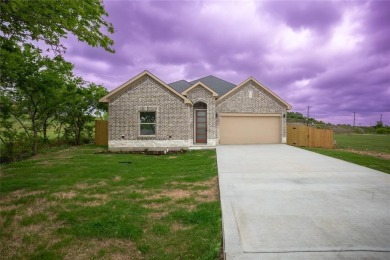This fresh and functional 3-bedroom, 2-bath home offers style on The Club At Runaway Bay in Texas - for sale on GolfHomes.com, golf home, golf lot