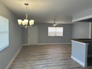 Renovated Waterfront Villa! Freshly painted, vinyl wood flooring on Kings Point Golf -Flanders Way in Florida - for sale on GolfHomes.com, golf home, golf lot