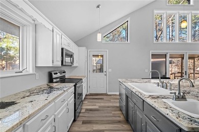 Nestled in Bella Vista, this one-of-a-kind retreat is surrounded on Bella Vista - Metfield Golf Complex and Country Club in Arkansas - for sale on GolfHomes.com, golf home, golf lot