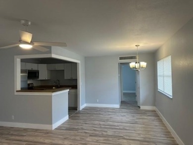 Renovated Waterfront Villa! Freshly painted, vinyl wood flooring on Kings Point Golf -Flanders Way in Florida - for sale on GolfHomes.com, golf home, golf lot