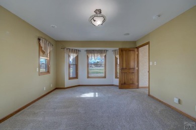 Right on the golf course! All new HVAC recently installed on Desert Hawk At Pueblo West in Colorado - for sale on GolfHomes.com, golf home, golf lot