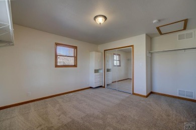 Right on the golf course! All new HVAC recently installed on Desert Hawk At Pueblo West in Colorado - for sale on GolfHomes.com, golf home, golf lot
