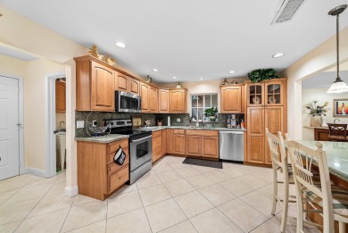 This premium water view residence offers 2,660 sq ft of living on Hunters Run Golf and Country Club in Florida - for sale on GolfHomes.com, golf home, golf lot