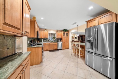 This premium water view residence offers 2,660 sq ft of living on Hunters Run Golf and Country Club in Florida - for sale on GolfHomes.com, golf home, golf lot