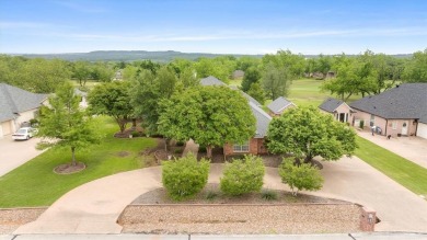 Discover your dream home nestled in coveted Pecan Plantation on Pecan Plantation Country Club in Texas - for sale on GolfHomes.com, golf home, golf lot