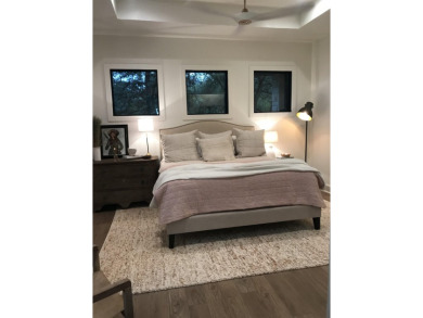 Stylish Hill Country contemporary home backing up to the #1 tee on Apple Rock Golf Course - Horseshoe Bay in Texas - for sale on GolfHomes.com, golf home, golf lot
