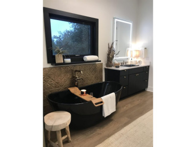 Stylish Hill Country contemporary home backing up to the #1 tee on Apple Rock Golf Course - Horseshoe Bay in Texas - for sale on GolfHomes.com, golf home, golf lot