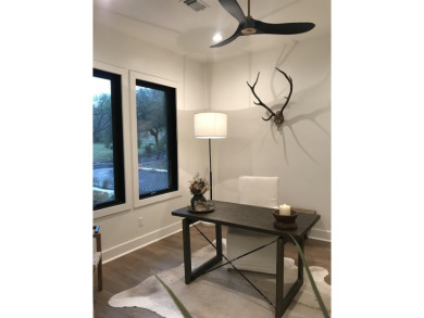 Stylish Hill Country contemporary home backing up to the #1 tee on Apple Rock Golf Course - Horseshoe Bay in Texas - for sale on GolfHomes.com, golf home, golf lot