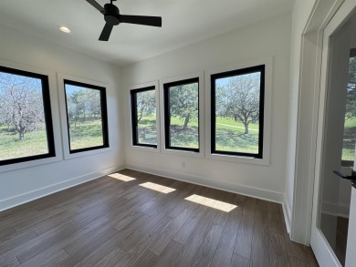 Stylish Hill Country contemporary home backing up to the #1 tee on Apple Rock Golf Course - Horseshoe Bay in Texas - for sale on GolfHomes.com, golf home, golf lot