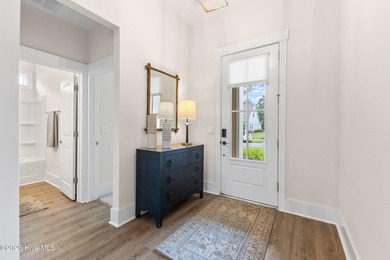 Located in the sought-after Heron Pointe neighborhood of on Cape Fear National At Brunswick Forest in North Carolina - for sale on GolfHomes.com, golf home, golf lot