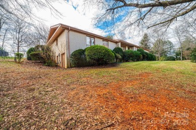 Nestled on the scenic Lake Hickory Country Club golf course on Lake Hickory Town Course in North Carolina - for sale on GolfHomes.com, golf home, golf lot