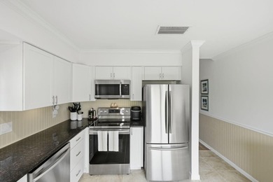 Discover this two-bedroom, two-bath end unit in Quail Meadows at on Martin Downs Country Club in Florida - for sale on GolfHomes.com, golf home, golf lot