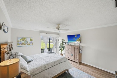 Discover this two-bedroom, two-bath end unit in Quail Meadows at on Martin Downs Country Club in Florida - for sale on GolfHomes.com, golf home, golf lot