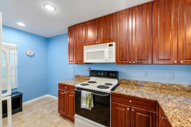 Welcome to this beautifully maintained 2-bedroom, 2-bathroom on Sabal Trace Golf and Country Club in Florida - for sale on GolfHomes.com, golf home, golf lot