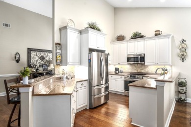 Soaring high ceilings, the inviting openness and hardwood floors on Woodside Plantation Country Club in South Carolina - for sale on GolfHomes.com, golf home, golf lot