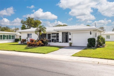 55+ Florida lifestyle at its finest! This updated Eden model on Mainlands Golf Club in Florida - for sale on GolfHomes.com, golf home, golf lot