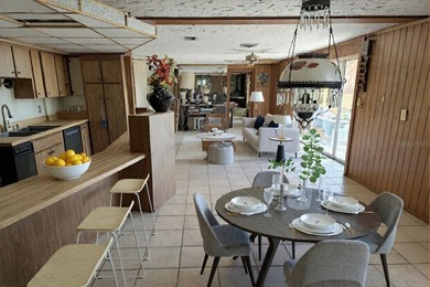 One or more photo(s) has been virtually staged. This charming on Jacaranda West Country Club in Florida - for sale on GolfHomes.com, golf home, golf lot