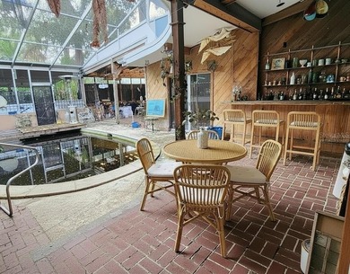 One or more photo(s) has been virtually staged. This charming on Jacaranda West Country Club in Florida - for sale on GolfHomes.com, golf home, golf lot