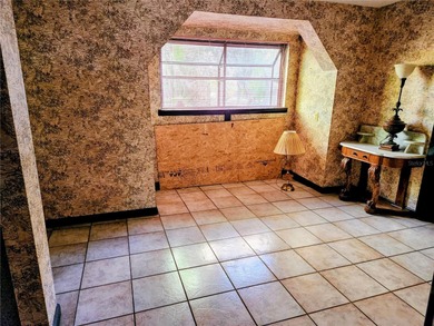 One or more photo(s) has been virtually staged. This charming on Jacaranda West Country Club in Florida - for sale on GolfHomes.com, golf home, golf lot