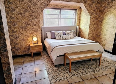 One or more photo(s) has been virtually staged. This charming on Jacaranda West Country Club in Florida - for sale on GolfHomes.com, golf home, golf lot