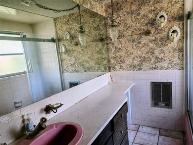 One or more photo(s) has been virtually staged. This charming on Jacaranda West Country Club in Florida - for sale on GolfHomes.com, golf home, golf lot