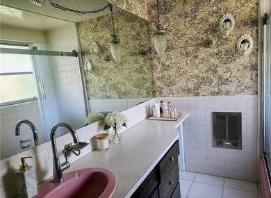 One or more photo(s) has been virtually staged. This charming on Jacaranda West Country Club in Florida - for sale on GolfHomes.com, golf home, golf lot