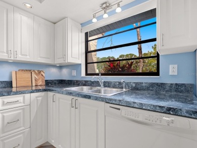 This charming 2-bedroom, 2-bath Briarfield villa is tucked on The Meadows Golf and Country Club in Florida - for sale on GolfHomes.com, golf home, golf lot