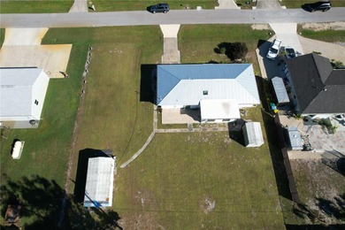 Excellent 2bd 2 bath home on triple lot with hurricane shutters on Deep Creek Golf Club in Florida - for sale on GolfHomes.com, golf home, golf lot