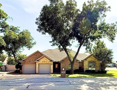 Nestled in a highly desirable gated community offering on Pecan Plantation Country Club in Texas - for sale on GolfHomes.com, golf home, golf lot