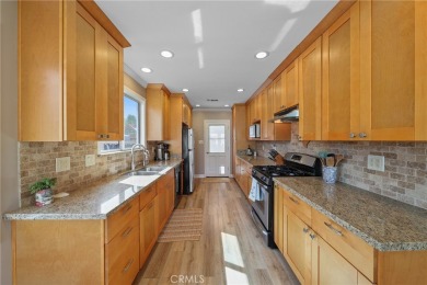 Discover warmth and comfort with this beautifully upgraded pool on Heartwell Golf Course in California - for sale on GolfHomes.com, golf home, golf lot