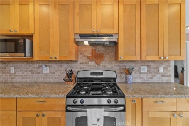 Discover warmth and comfort with this beautifully upgraded pool on Heartwell Golf Course in California - for sale on GolfHomes.com, golf home, golf lot