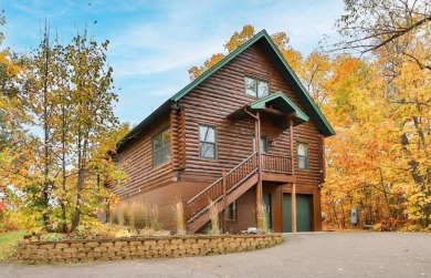 Enjoy relaxing on the large 10x30 deck overlooking the 11th hole on Hardwoods Golf Club At Mille Lacs in Minnesota - for sale on GolfHomes.com, golf home, golf lot