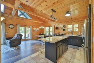 Enjoy relaxing on the large 10x30 deck overlooking the 11th hole on Hardwoods Golf Club At Mille Lacs in Minnesota - for sale on GolfHomes.com, golf home, golf lot