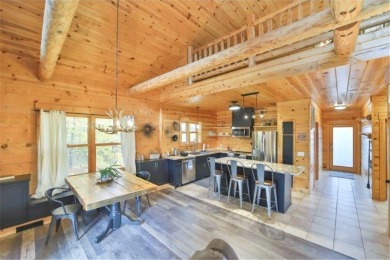 Enjoy relaxing on the large 10x30 deck overlooking the 11th hole on Hardwoods Golf Club At Mille Lacs in Minnesota - for sale on GolfHomes.com, golf home, golf lot