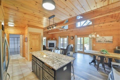 Enjoy relaxing on the large 10x30 deck overlooking the 11th hole on Hardwoods Golf Club At Mille Lacs in Minnesota - for sale on GolfHomes.com, golf home, golf lot