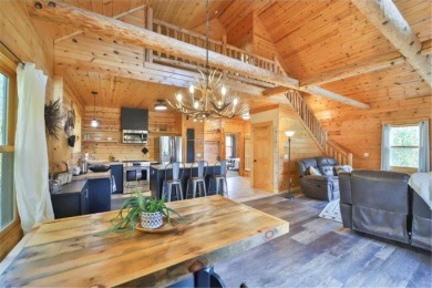 Enjoy relaxing on the large 10x30 deck overlooking the 11th hole on Hardwoods Golf Club At Mille Lacs in Minnesota - for sale on GolfHomes.com, golf home, golf lot